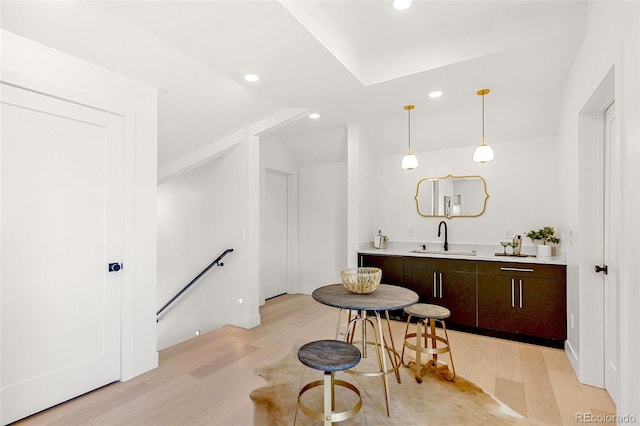 4520 W Moncrieff Pl, Denver, CO 80212 - bar area with light wood-style flooring, recessed lighting, decorative light fixtures, and lofted ceiling