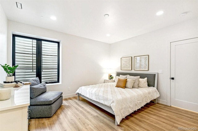 4520 W Moncrieff Pl, Denver, CO 80212 - bedroom with light wood-style flooring and recessed lighting