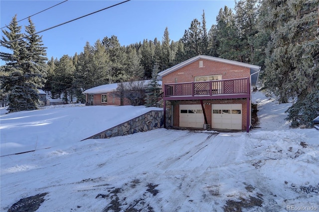 exterior space with a wooden deck and a garage