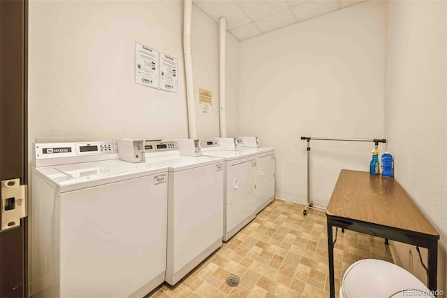 1140 Columbine St Unit 106, Denver, CO 80206 - shared laundry room featuring separate washer and dryer and baseboards