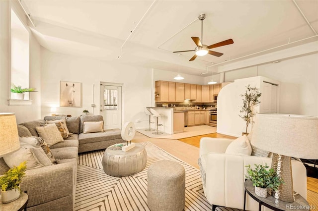 1140 Columbine St Unit 106, Denver, CO 80206 - living area featuring a ceiling fan and light wood-style floors