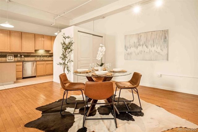 1140 Columbine St Unit 106, Denver, CO 80206 - dining room with rail lighting and light wood finished floors