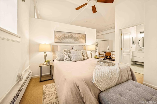 1140 Columbine St Unit 106, Denver, CO 80206 - carpeted bedroom featuring baseboard heating, baseboards, connected bathroom, and a ceiling fan
