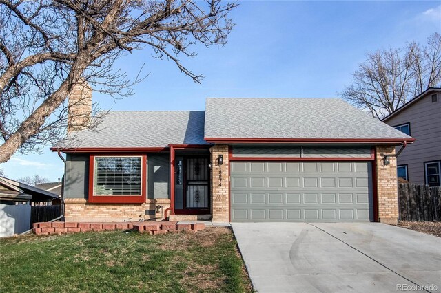 view of front of home featuring roof with shingles, fence, brick siding, an attached garage, and driveway