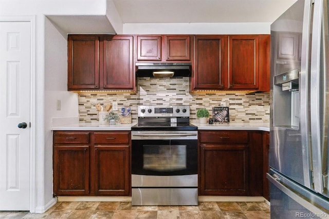 kitchen with appliances with stainless steel finishes and backsplash