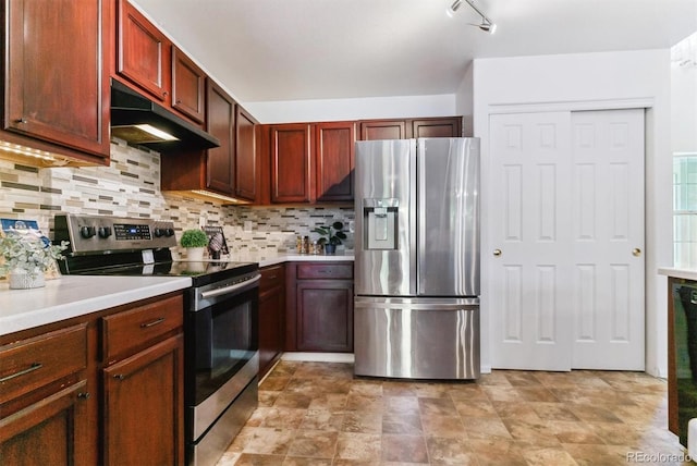 kitchen featuring decorative backsplash and appliances with stainless steel finishes