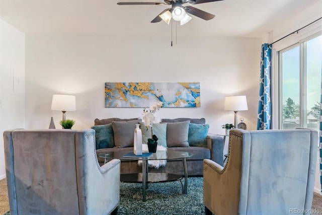 carpeted living room featuring ceiling fan