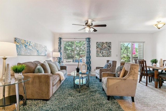 living room featuring ceiling fan and carpet floors