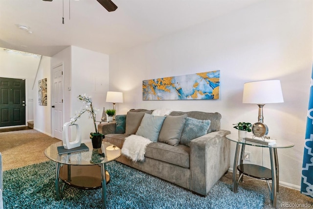 carpeted living room with ceiling fan