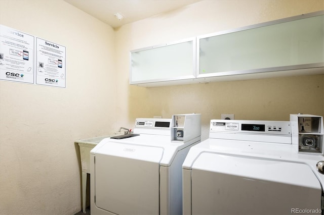 community laundry with washer and clothes dryer