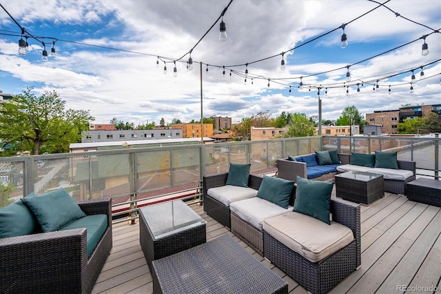 wooden terrace featuring an outdoor living space