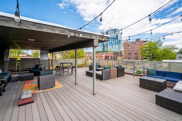 wooden terrace featuring an outdoor hangout area