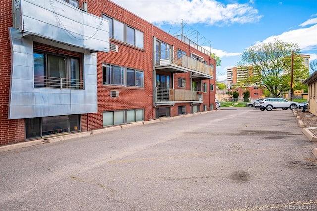 view of property featuring uncovered parking