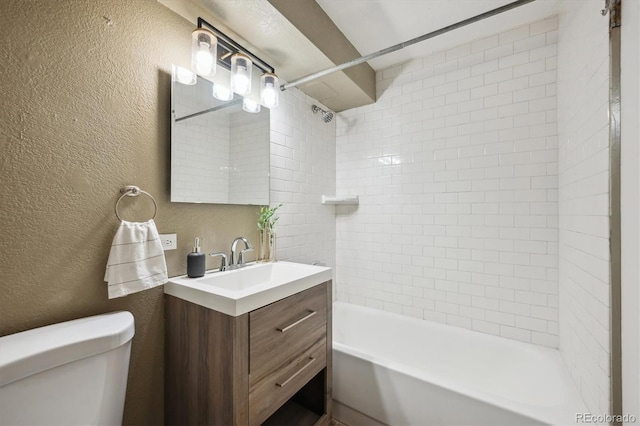 75 N Emerson St Unit 104, Denver, CO 80218 - full bathroom with a textured wall, vanity, toilet, and  shower combination