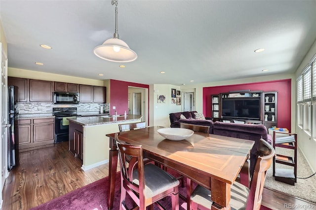 5280 Raritan Way, Denver, CO 80221 - dining area with dark wood-style flooring and recessed lighting