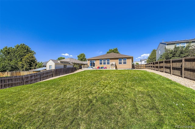 5280 Raritan Way, Denver, CO 80221 - rear view of house featuring a fenced backyard and a patio