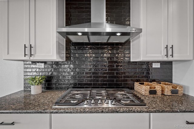 6678 Cumbre Vista Way, Colorado Springs, CO 80924 - kitchen with backsplash, white cabinets, wall chimney exhaust hood, and stainless steel gas cooktop