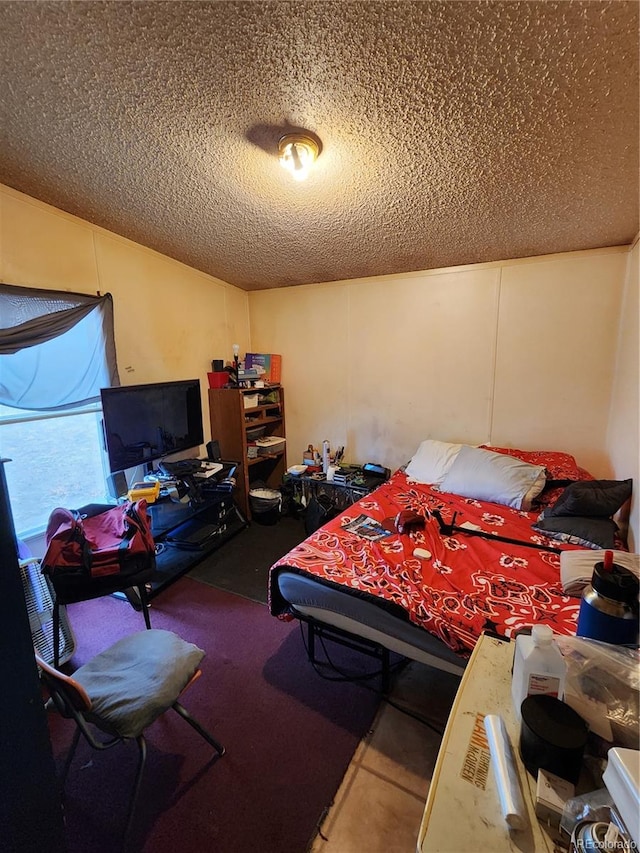 bedroom featuring a textured ceiling