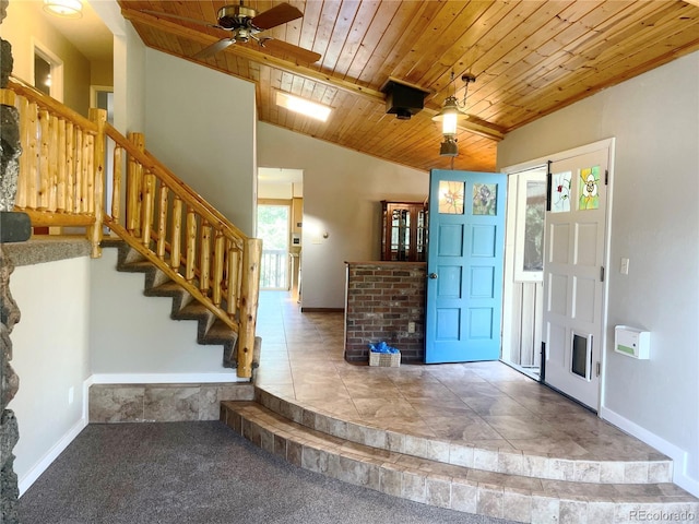 11608 Apache Trl, Conifer, CO 80433 - carpeted foyer entrance with wooden ceiling, vaulted ceiling, stairs, baseboards, and ceiling fan