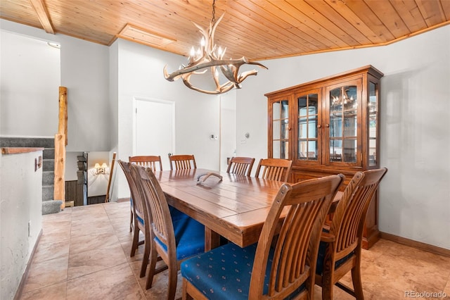 11608 Apache Trl, Conifer, CO 80433 - dining area with wood ceiling, a chandelier, and light tile patterned floors