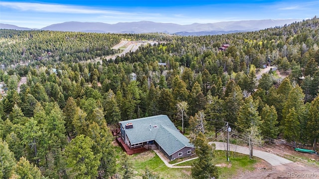 11608 Apache Trl, Conifer, CO 80433 - view from above of property with a heavily wooded area and mountains