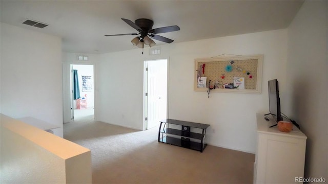 interior space featuring ceiling fan and visible vents