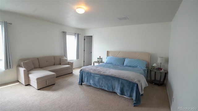 carpeted bedroom with visible vents
