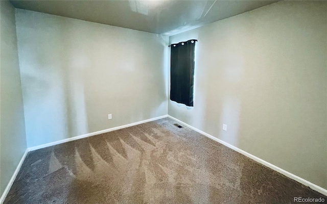 empty room featuring carpet flooring