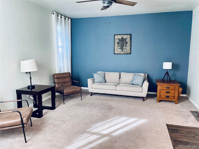 living room featuring light carpet and ceiling fan