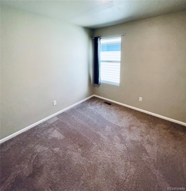 spare room featuring carpet floors