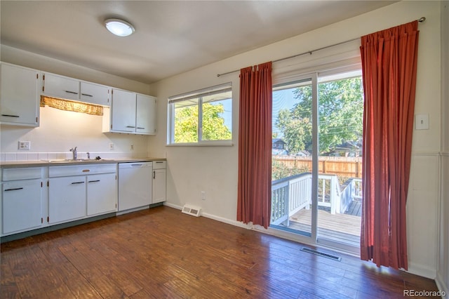 kitchen featuring dishwasher, white cabinetry, a healthy amount of sunlight, and dark hardwood / wood-style flooring