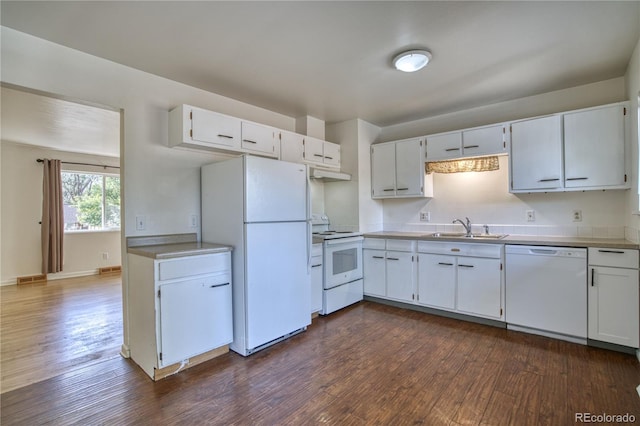 kitchen featuring sink, white cabinets, and white appliances