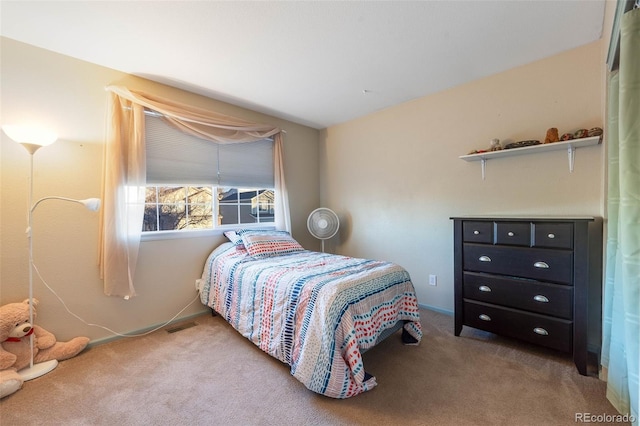 bedroom featuring carpet flooring and visible vents