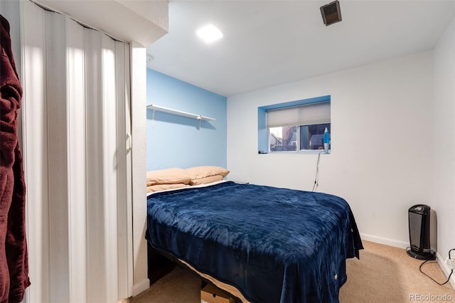 bedroom featuring carpet flooring, visible vents, and baseboards