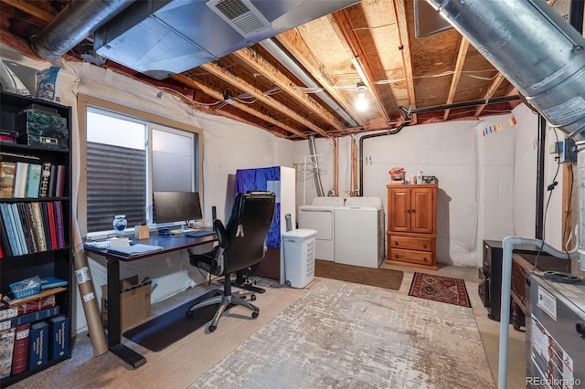 office area featuring visible vents and washing machine and clothes dryer