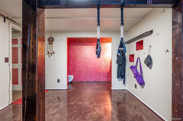 hallway featuring finished concrete floors