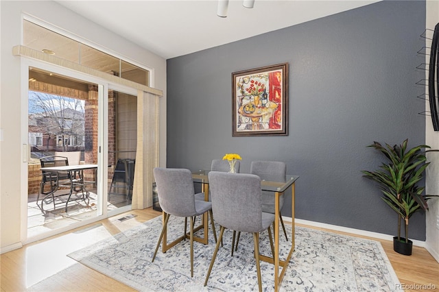 dining room with light hardwood / wood-style flooring