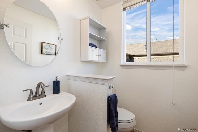 bathroom with sink and toilet