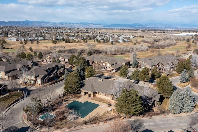 birds eye view of property with a mountain view