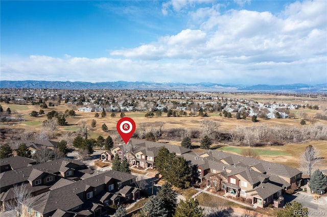 birds eye view of property with a mountain view