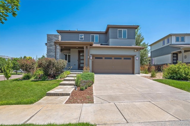 10844 Telluride St, Commerce City, CO 80022 - view of front facade featuring concrete driveway, an attached garage, and a front yard
