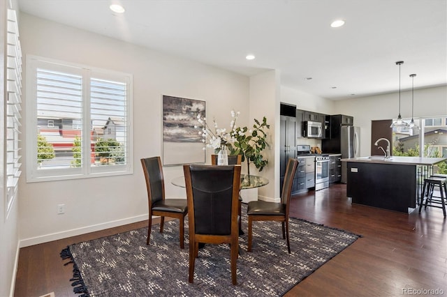 10844 Telluride St, Commerce City, CO 80022 - dining space with plenty of natural light, dark wood-style flooring, and recessed lighting