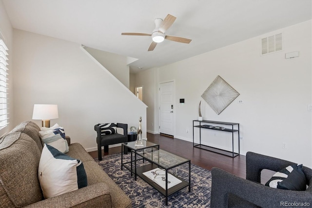 10844 Telluride St, Commerce City, CO 80022 - living area featuring stairway, ceiling fan, plenty of natural light, and wood finished floors