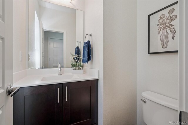 10844 Telluride St, Commerce City, CO 80022 - bathroom with vanity and toilet