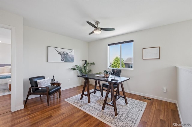 10844 Telluride St, Commerce City, CO 80022 - home office with a ceiling fan and wood finished floors