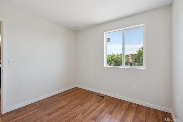 10844 Telluride St, Commerce City, CO 80022 - unfurnished room with baseboards and wood finished floors