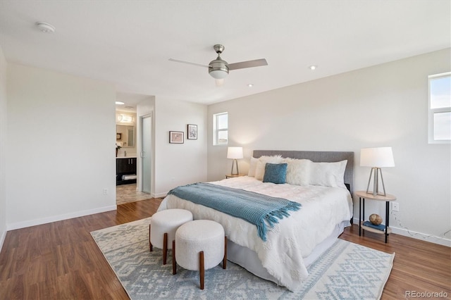 10844 Telluride St, Commerce City, CO 80022 - bedroom featuring multiple windows, wood finished floors, a ceiling fan, and ensuite bathroom