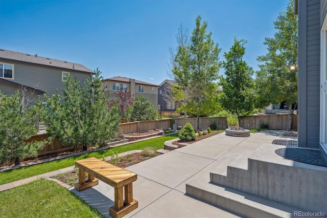 10844 Telluride St, Commerce City, CO 80022 - fenced backyard featuring a fire pit and a patio area
