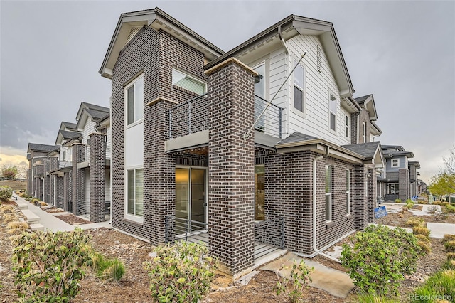 view of side of property with brick siding