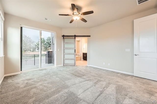 unfurnished bedroom with carpet flooring, access to outside, baseboards, and visible vents
